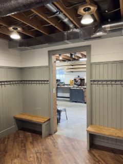 FInished mudroom paneling benches