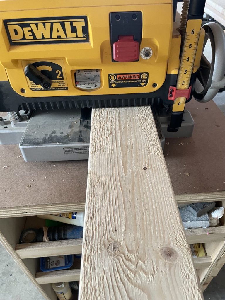 Planing down dimensional lumber for door
