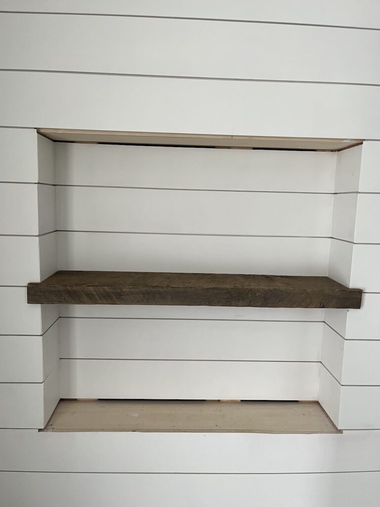 Installed middle shelf made of reclaimed wood