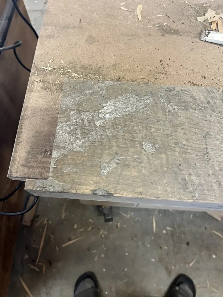 Silver paint on reclaimed wood after sanding