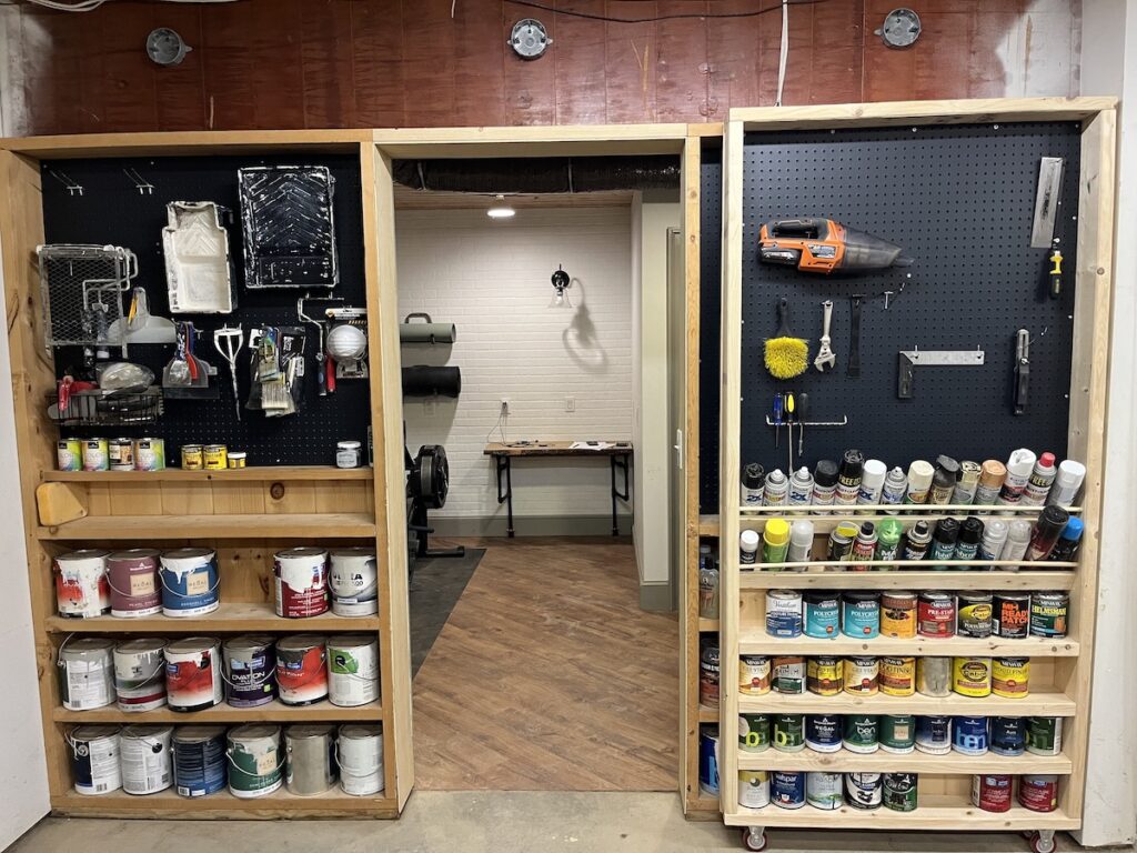 Painted pegboard on rolling storage shelves
