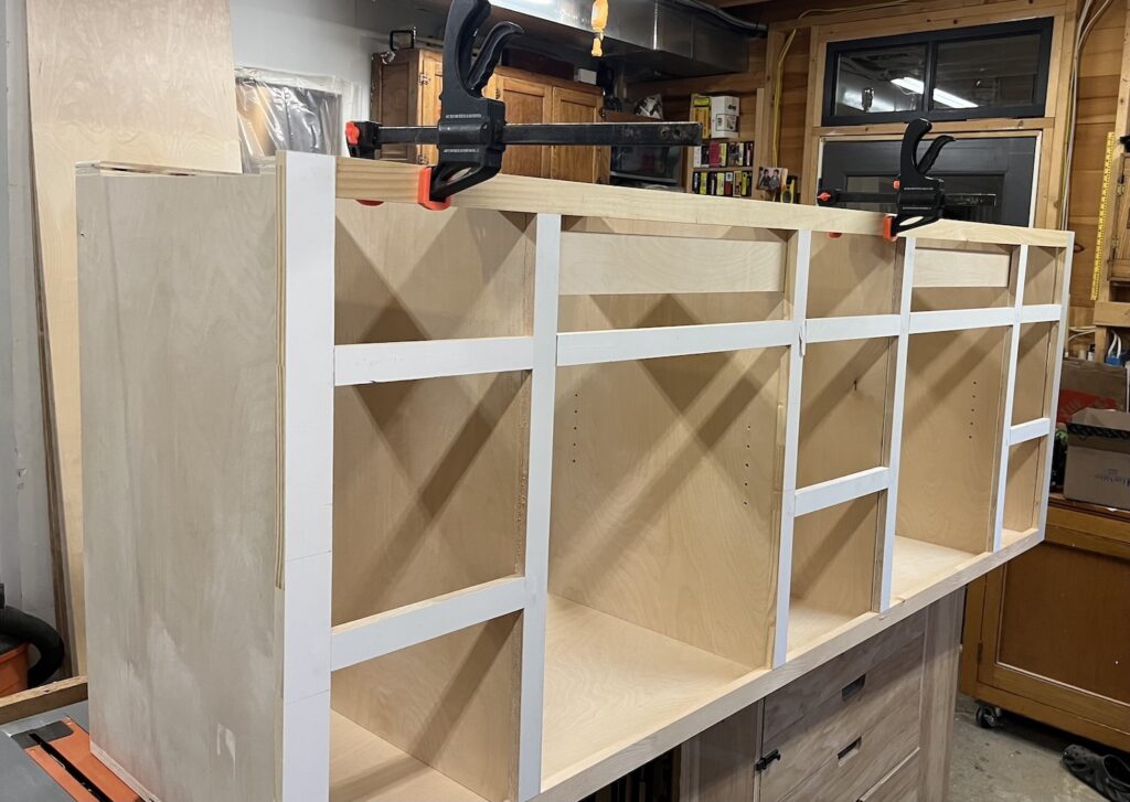 Clamped mock face frame to cabinet boxes