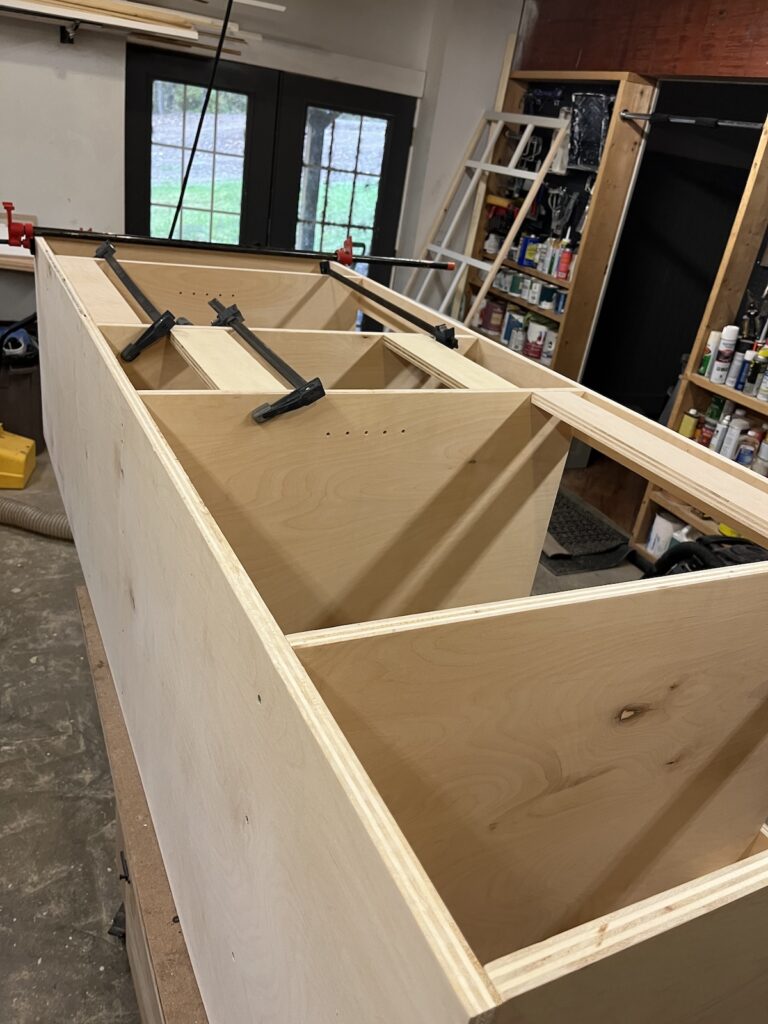 Assembling cabinet boxes with spacers