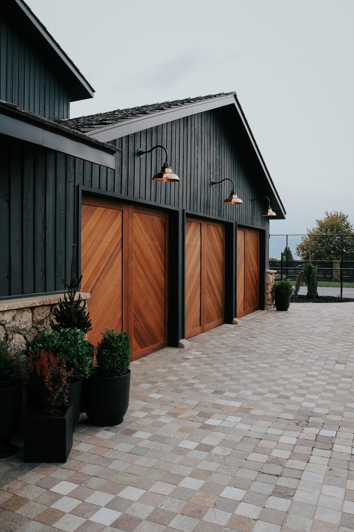 Nesting with Grace black garage with wood doors